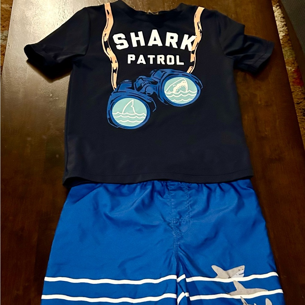 Boys size 5t bathing suit shorts and rash guard.